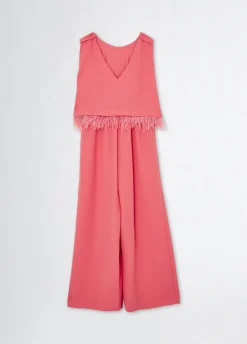 Tuta elegante con piume